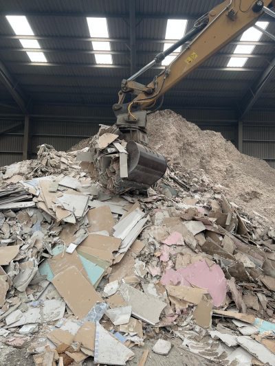 plasterboard being selected by grab crane plasterboard being selected by grab crane